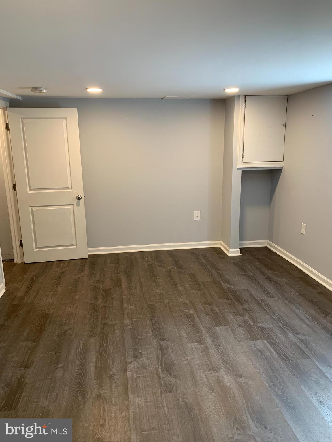 4429 Newport Avenue Baltimore, MD 21211 - Photo 12 of 17 an empty room with wooden floor