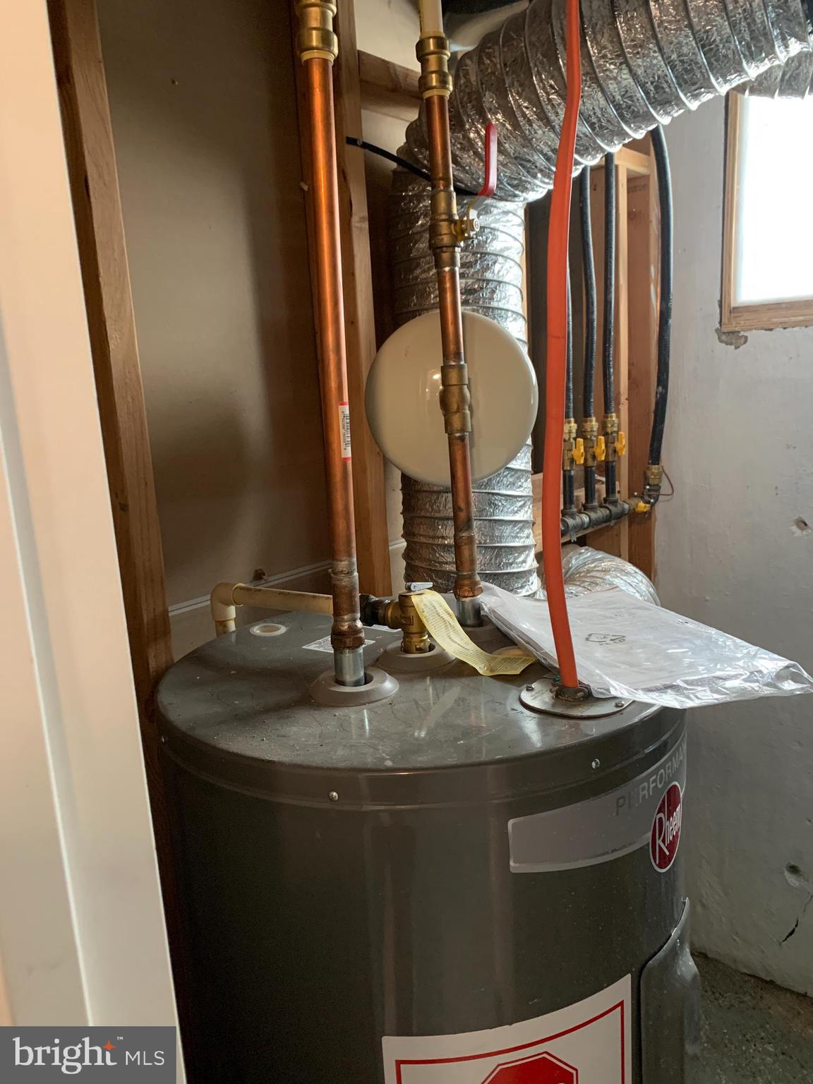 4429 Newport Avenue Baltimore, MD 21211 - Photo 17 of 17 a bathroom with a granite countertop sink a mirror and shower
