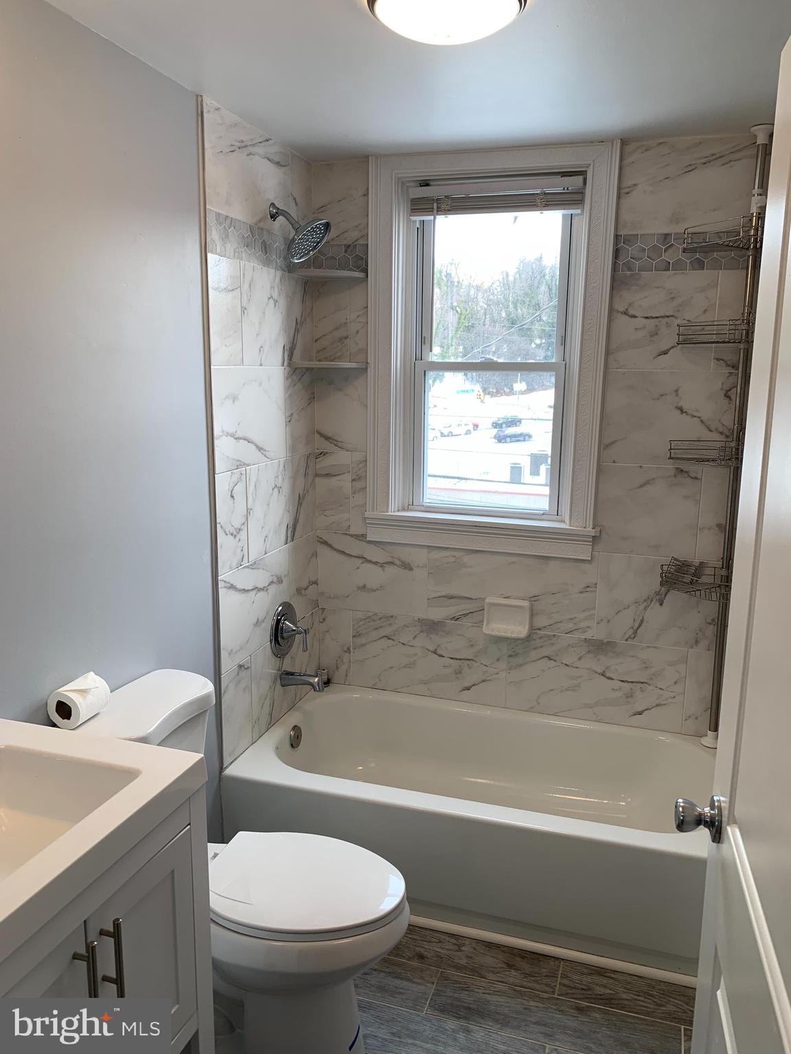 4429 Newport Avenue Baltimore, MD 21211 - Photo 5 of 17 a bathroom with a sink toilet and bathtub