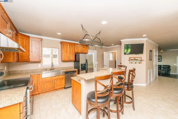 a large white kitchen with a large window