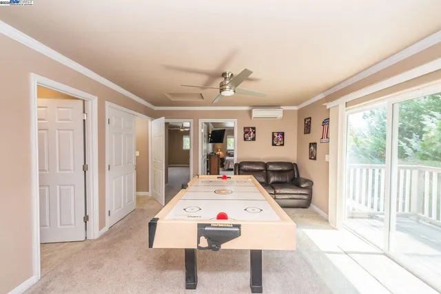 a room with storage and pool table