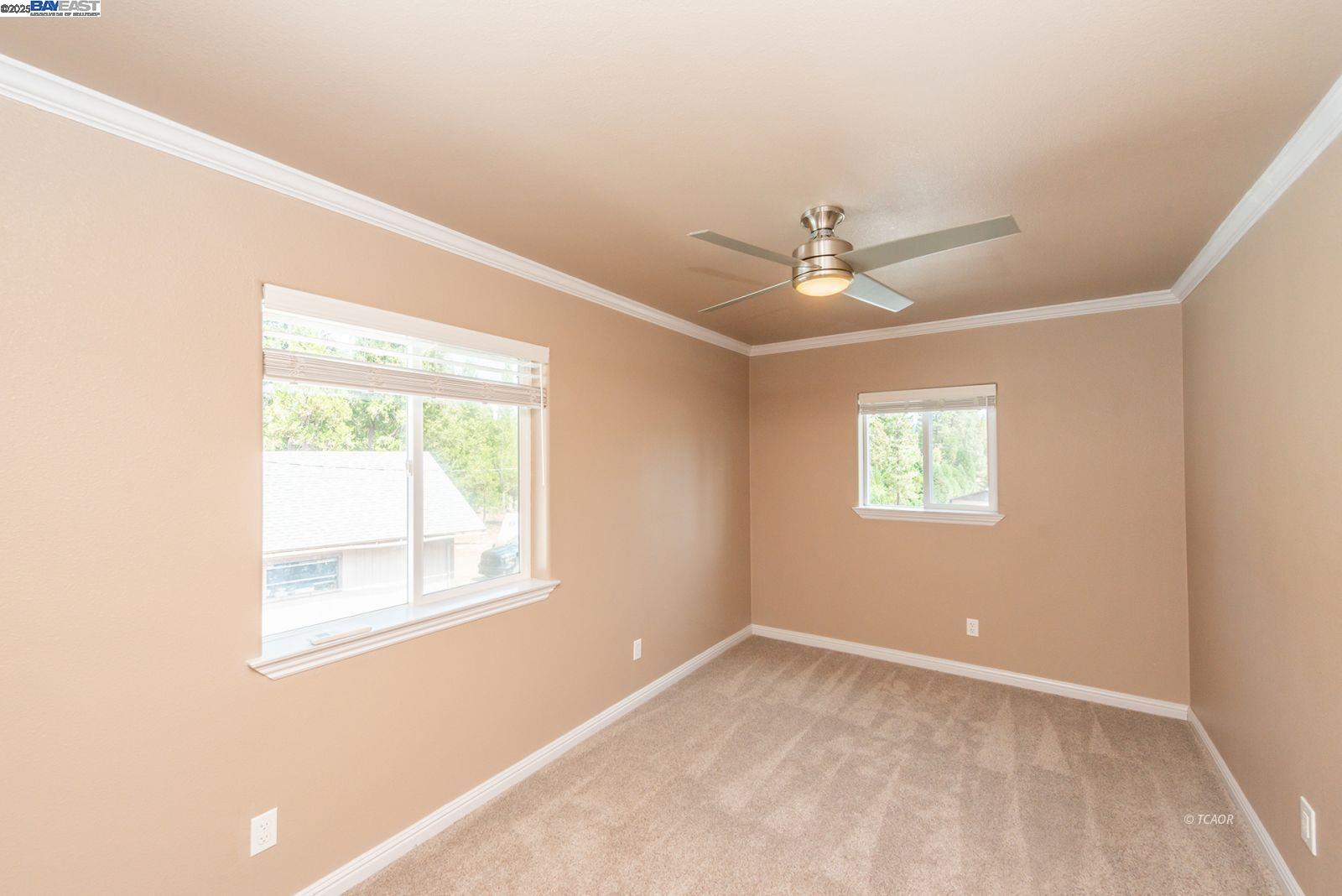 250 Mary Avenue Trinity Center, CA 96091 - Photo 31 of 49 an empty room with a window and a ceiling fan