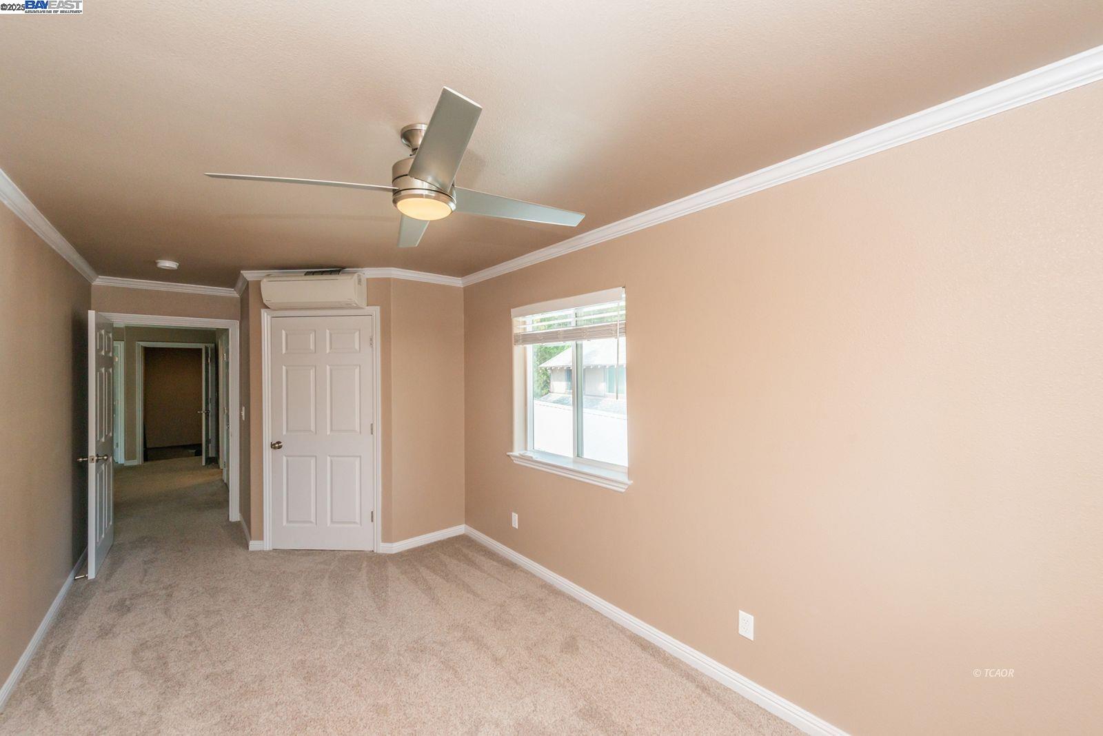 250 Mary Avenue Trinity Center, CA 96091 - Photo 32 of 49 an empty room with ceiling fan and window
