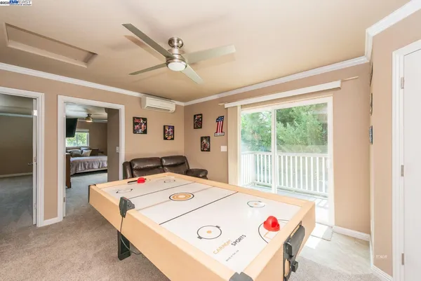 a view of a dining table and chairs in a room