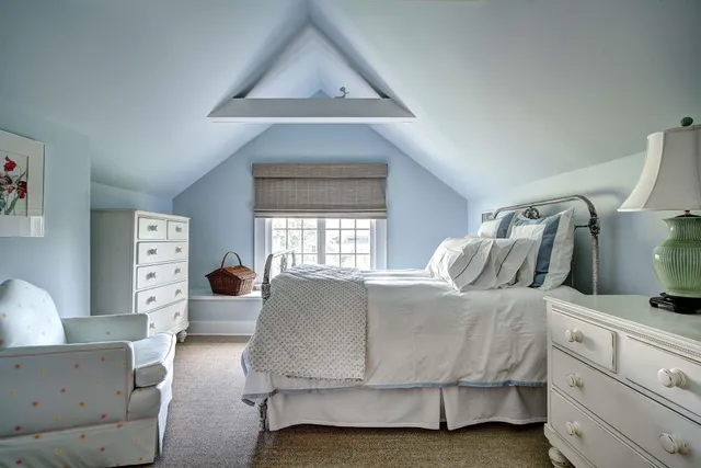 a bathroom with a granite countertop sink mirror and window