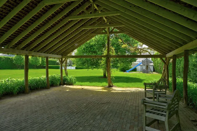 a bedroom with a large bed and a large window