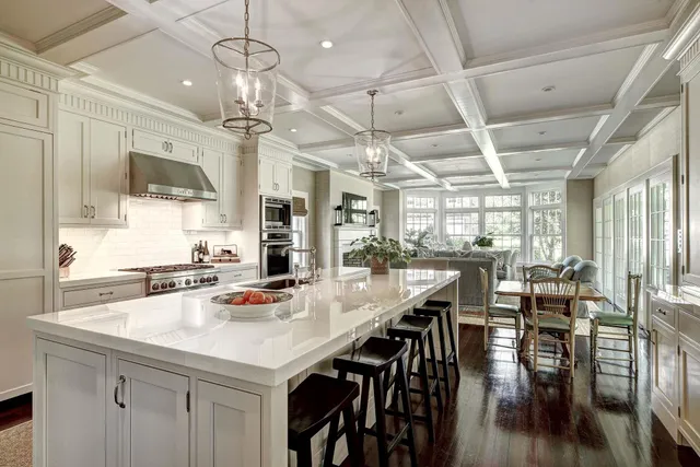 a front view of a house with yard and green space