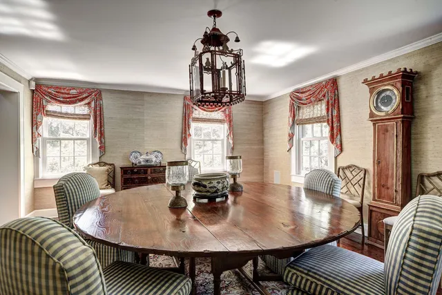 a dining room with furniture and wooden floor