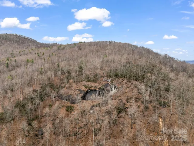 a view of a large building with lots of trees