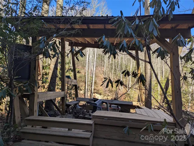 a view of a backyard with potted plants