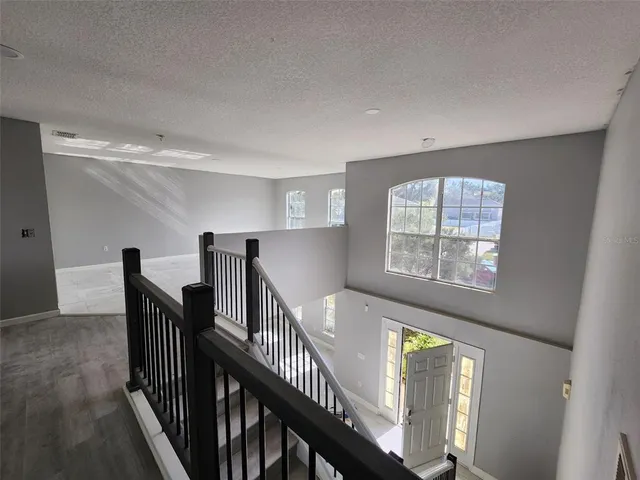 a view of an entryway with wooden floor