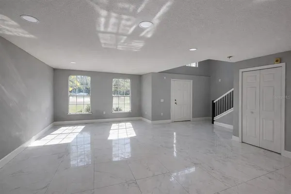 a view of an empty room with a window
