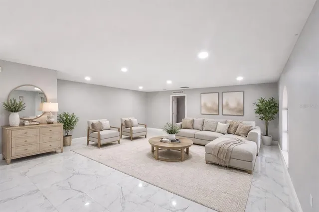 a living room with furniture and window