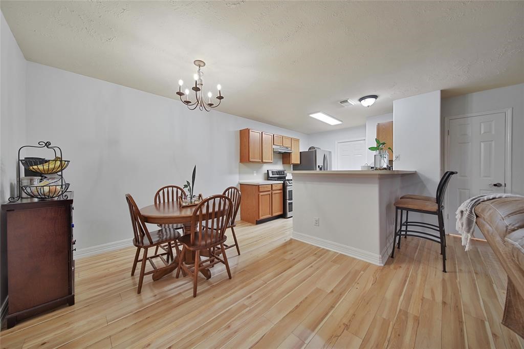 16923 Lockford Lane Houston, TX 77073 - Photo 5 of 7 a dining room with furniture and wooden floor