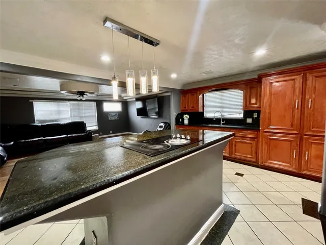 a living room with furniture a rug and a window