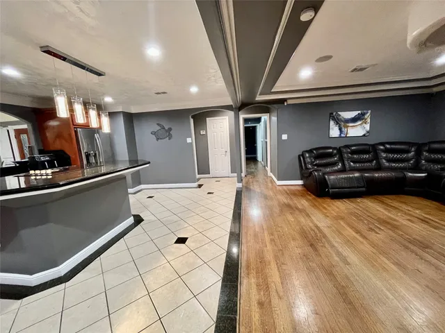 a bathroom with a toilet mirror and vanity