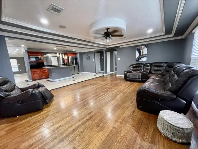 a view of a backyard with plants and outdoor seating