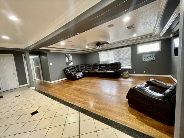 a view of a backyard with table and chairs under an umbrella