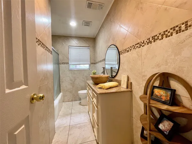 a view of a backyard with sitting area furniture and garden