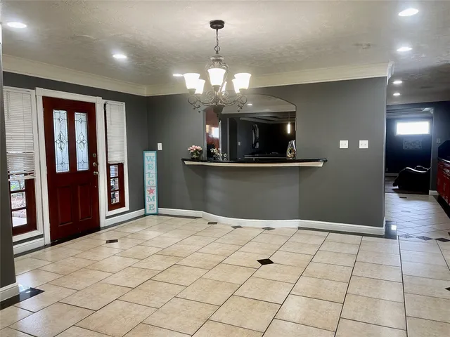 a spacious bedroom with a bed and a ceiling fan