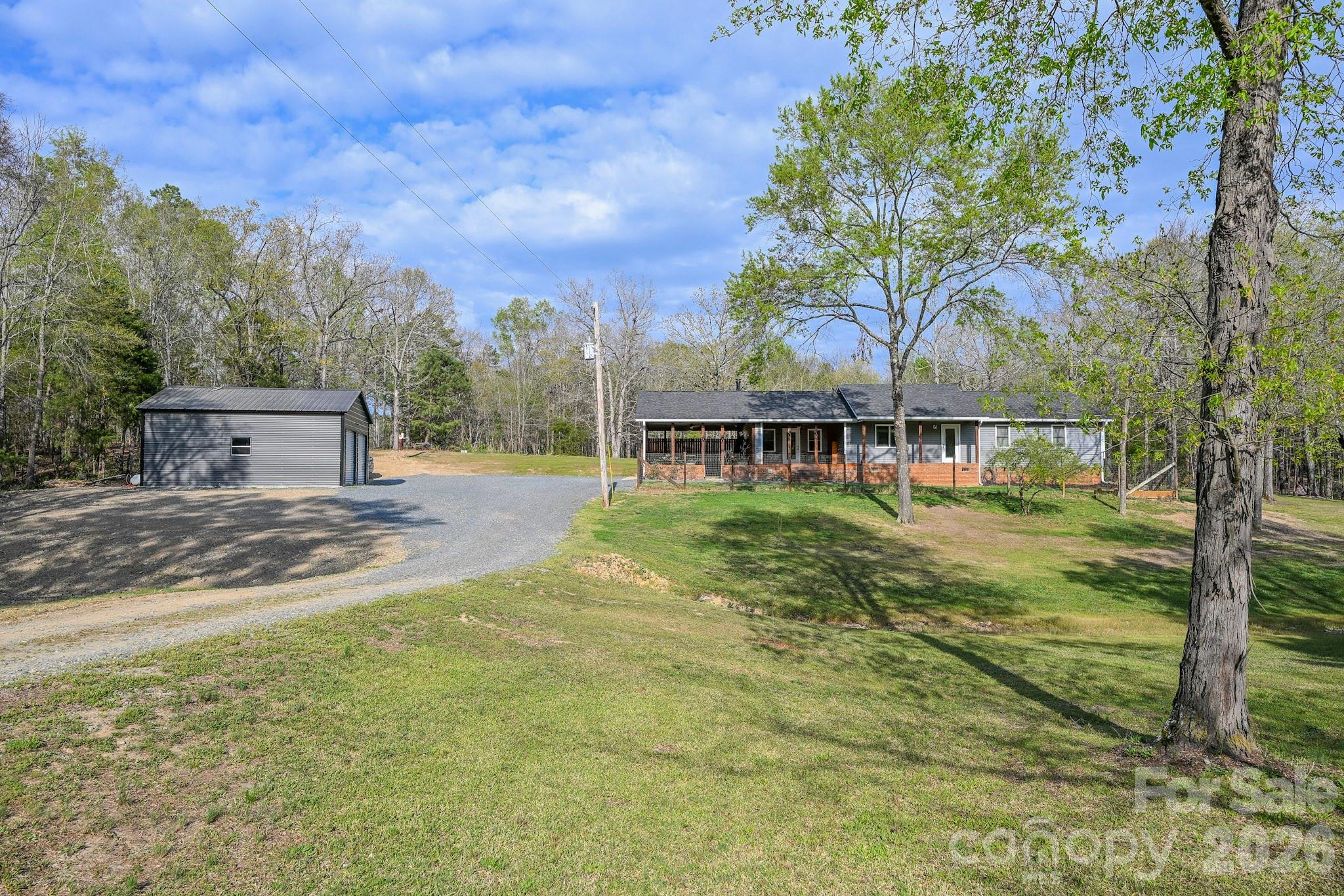1925 Sojourn Road Marshville, NC 28103 - Photo 1 of 41 a view of a house with backyard and a tree