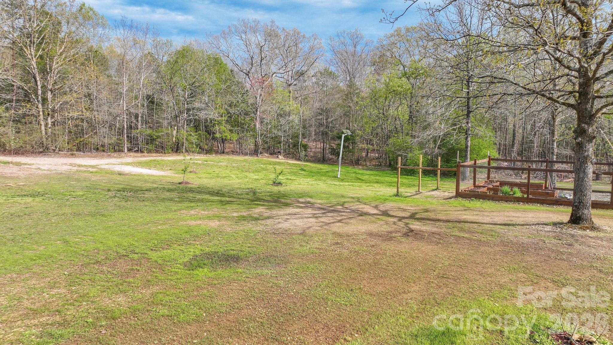 1925 Sojourn Road Marshville, NC 28103 - Photo 11 of 41 a view of a park with large trees