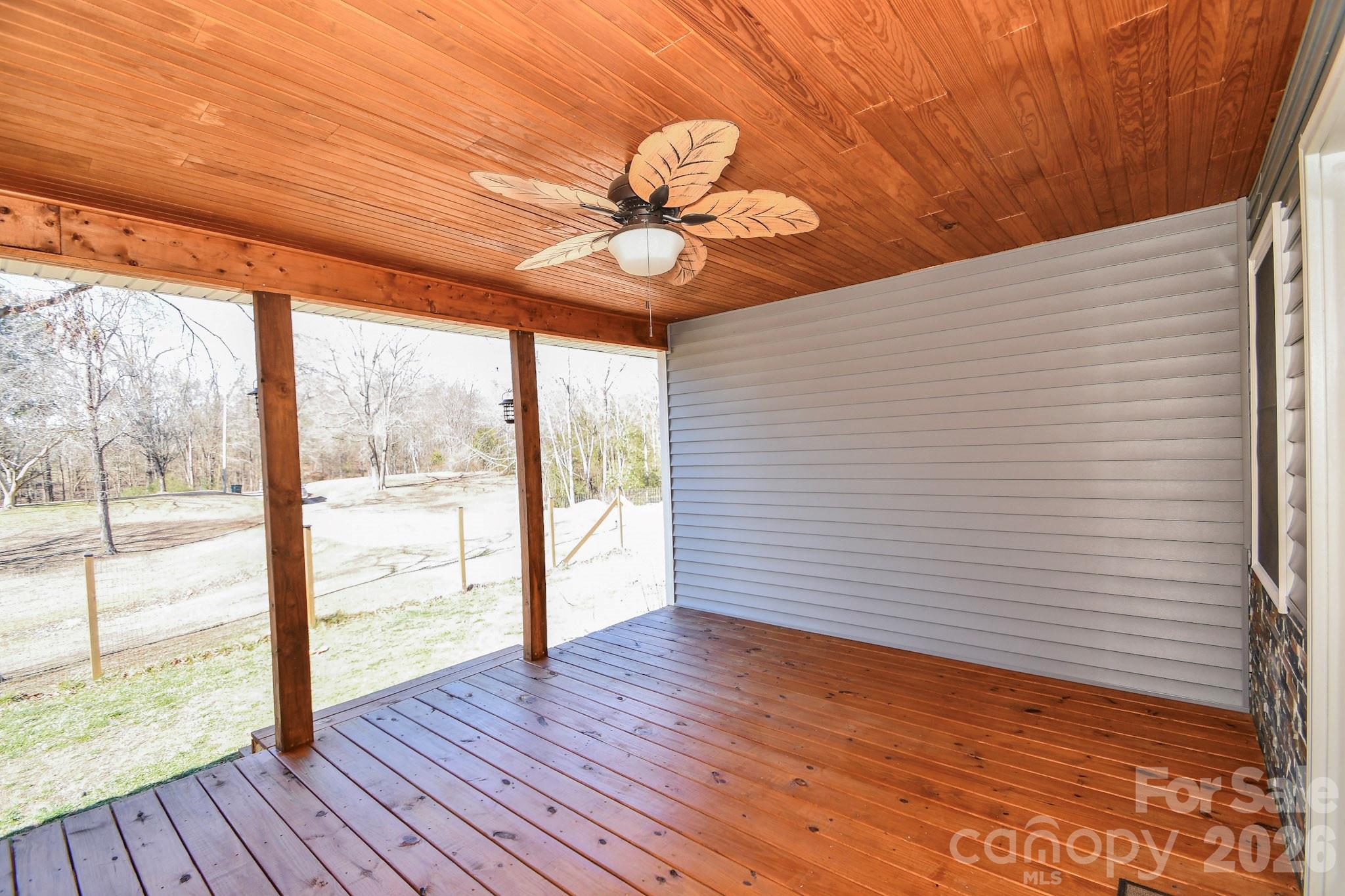 1925 Sojourn Road Marshville, NC 28103 - Photo 22 of 41 a view of an empty room with wooden floor and a window
