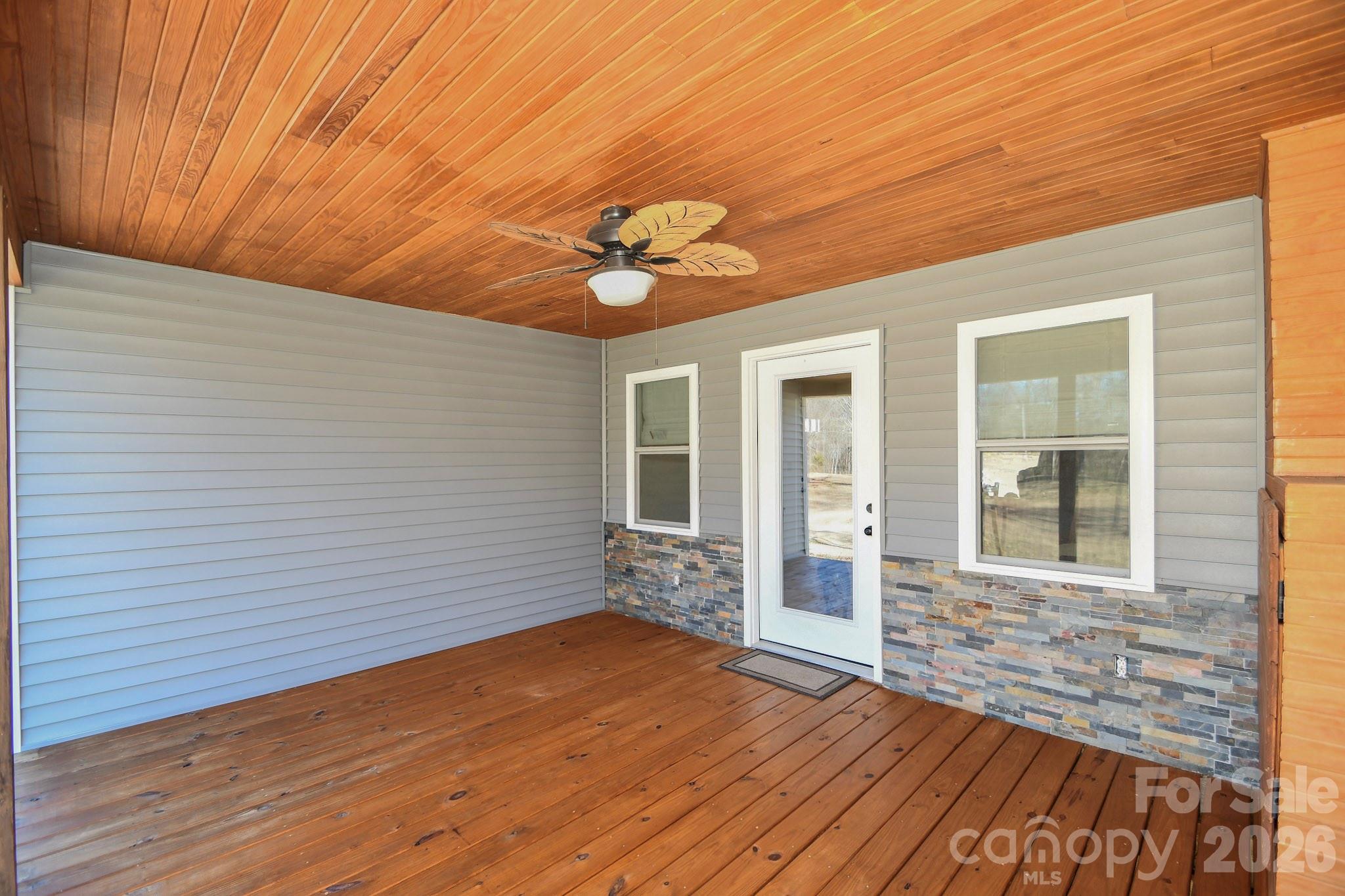 1925 Sojourn Road Marshville, NC 28103 - Photo 23 of 41 a view of a livingroom with wooden floor and a ceiling fan