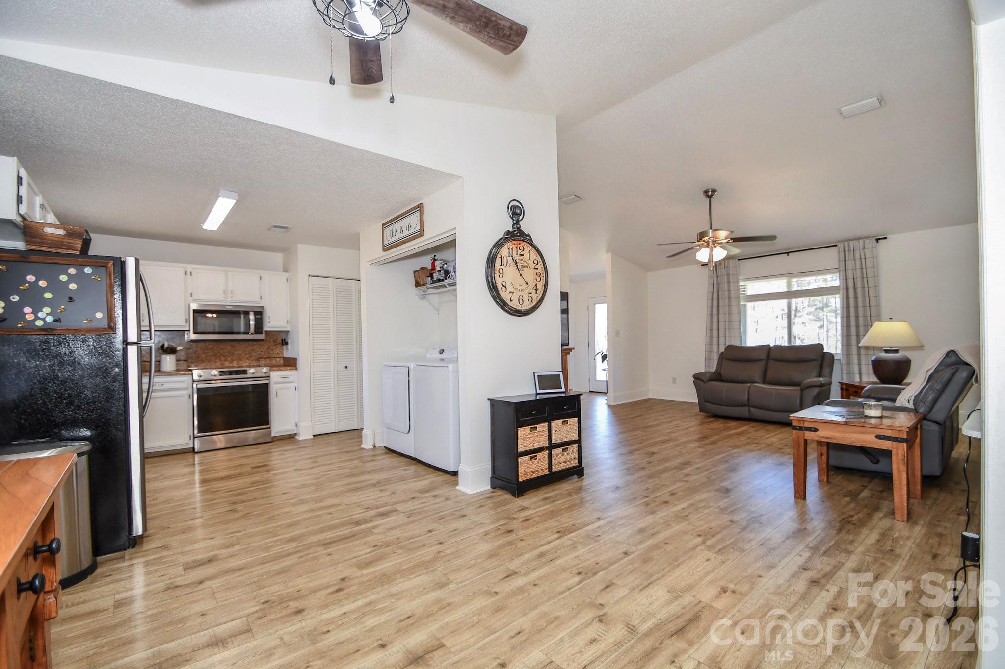 1925 Sojourn Road Marshville, NC 28103 - Photo 30 of 41 a living room with furniture and a wooden floor