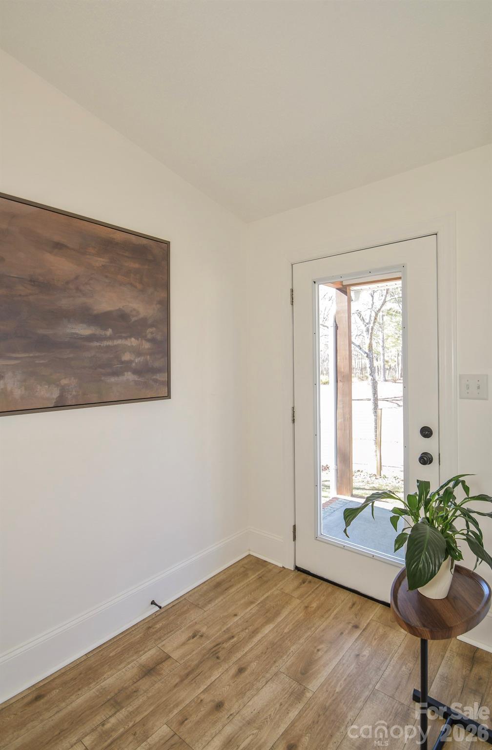 1925 Sojourn Road Marshville, NC 28103 - Photo 31 of 41 a view of a room with wooden floor and chair