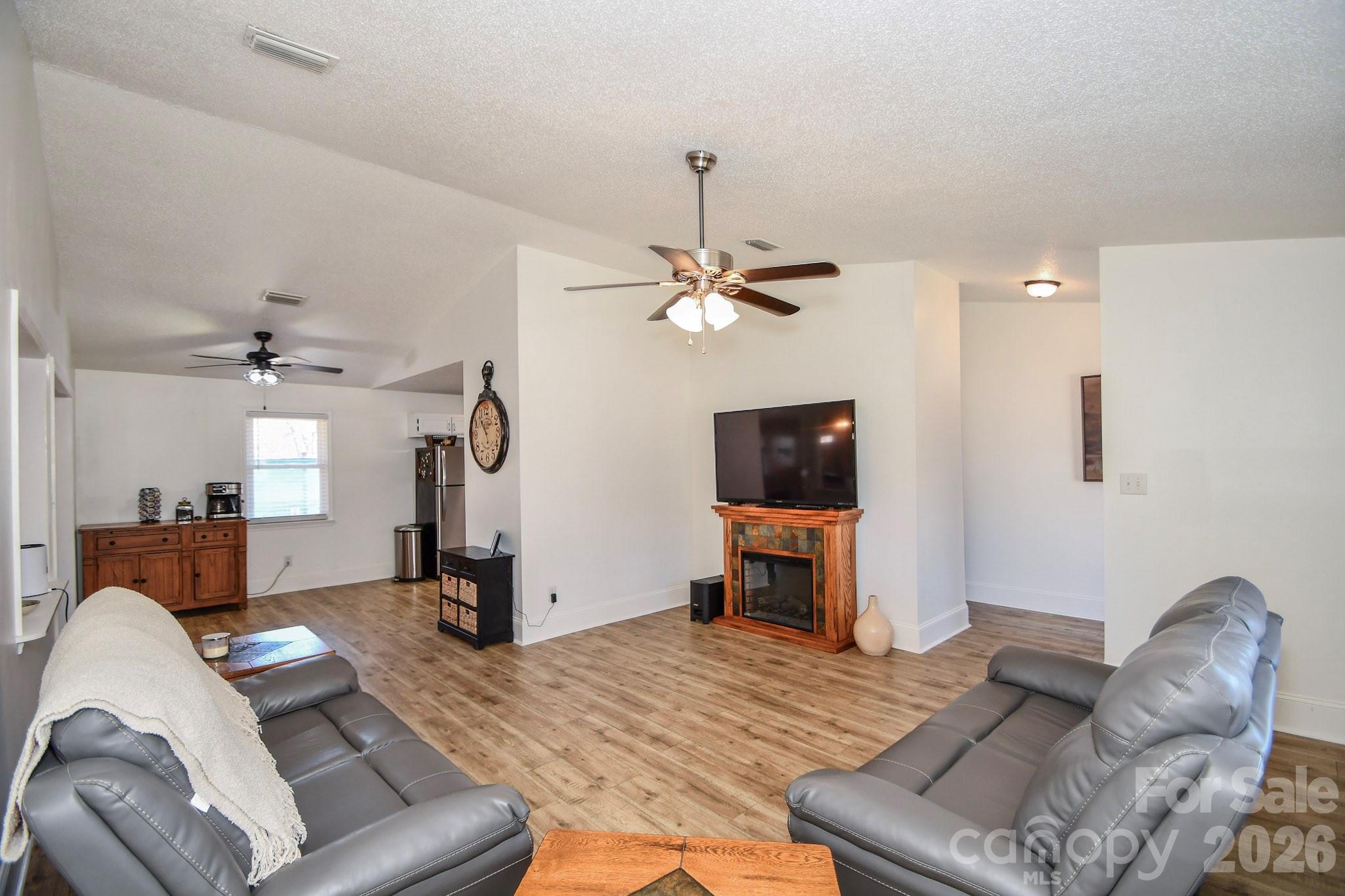 1925 Sojourn Road Marshville, NC 28103 - Photo 35 of 41 a living room with furniture and a flat screen tv