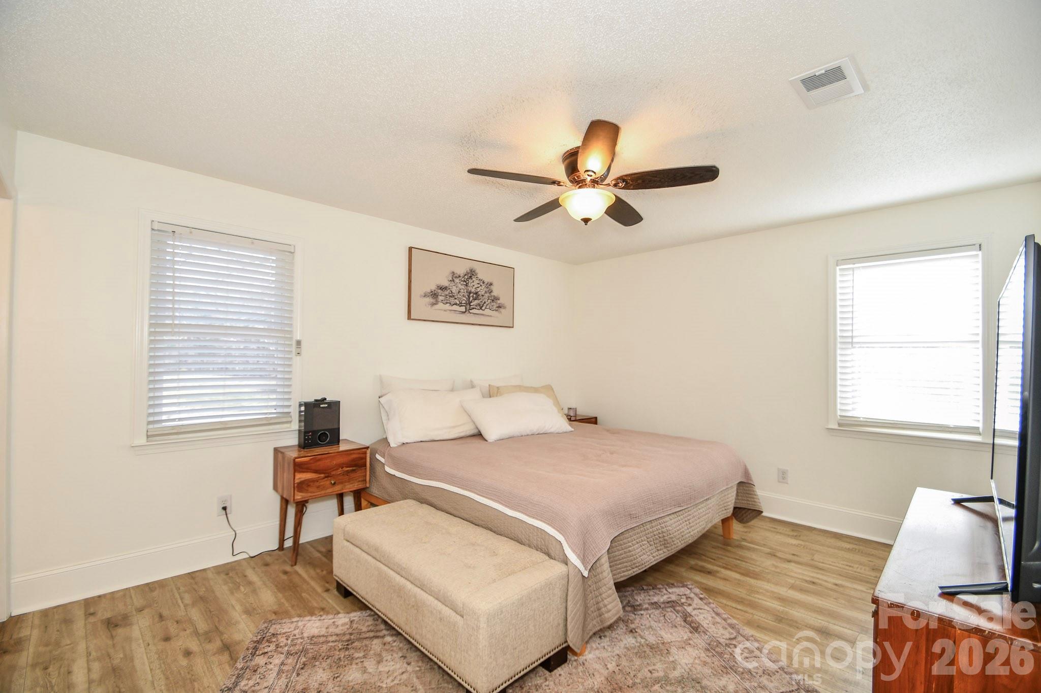 1925 Sojourn Road Marshville, NC 28103 - Photo 36 of 41 a bedroom with a bed a window and a couch