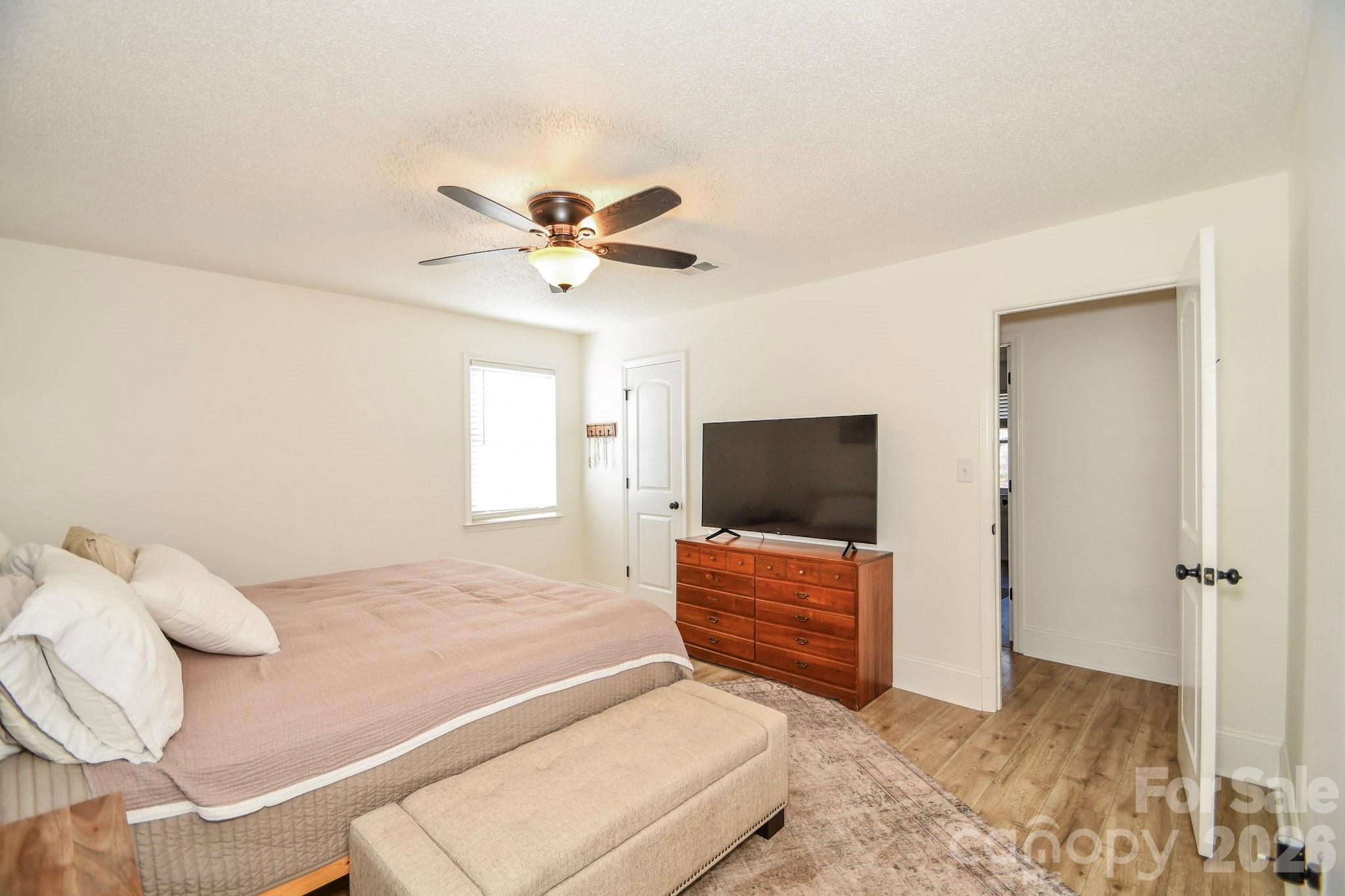 1925 Sojourn Road Marshville, NC 28103 - Photo 37 of 41 a bedroom with a bed and a flat screen tv