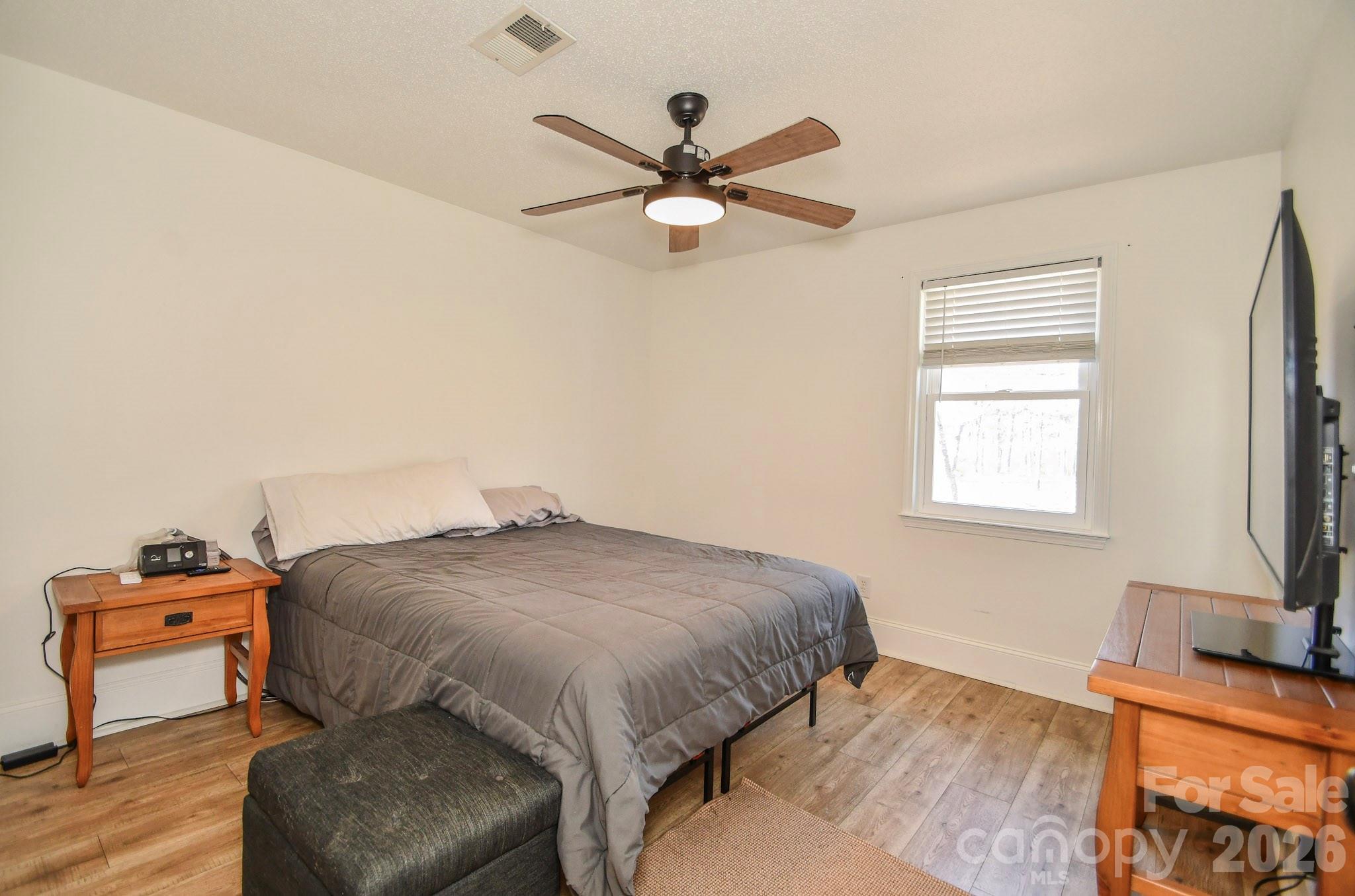 1925 Sojourn Road Marshville, NC 28103 - Photo 39 of 41 a bedroom with a bed and a flat screen tv