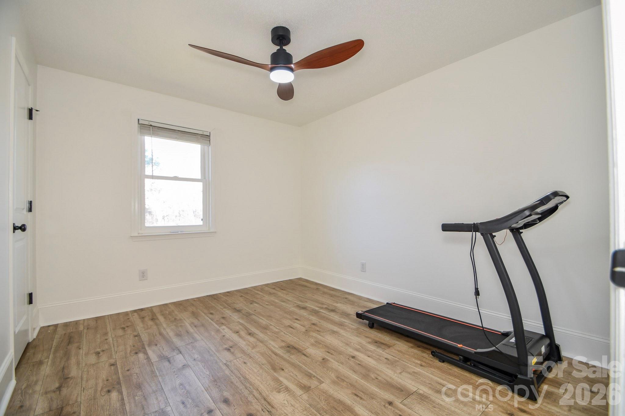 1925 Sojourn Road Marshville, NC 28103 - Photo 40 of 41 a view of a room with gym equipment and a window