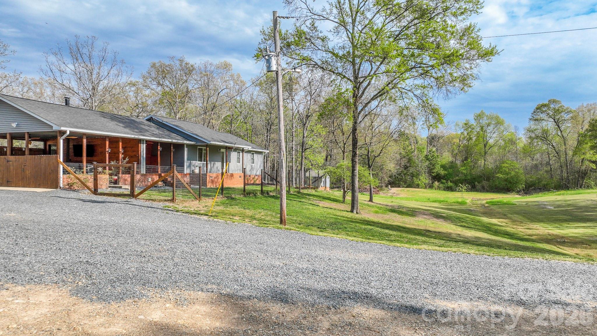 1925 Sojourn Road Marshville, NC 28103 - Photo 4 of 41 a view of a house with a yard and large trees