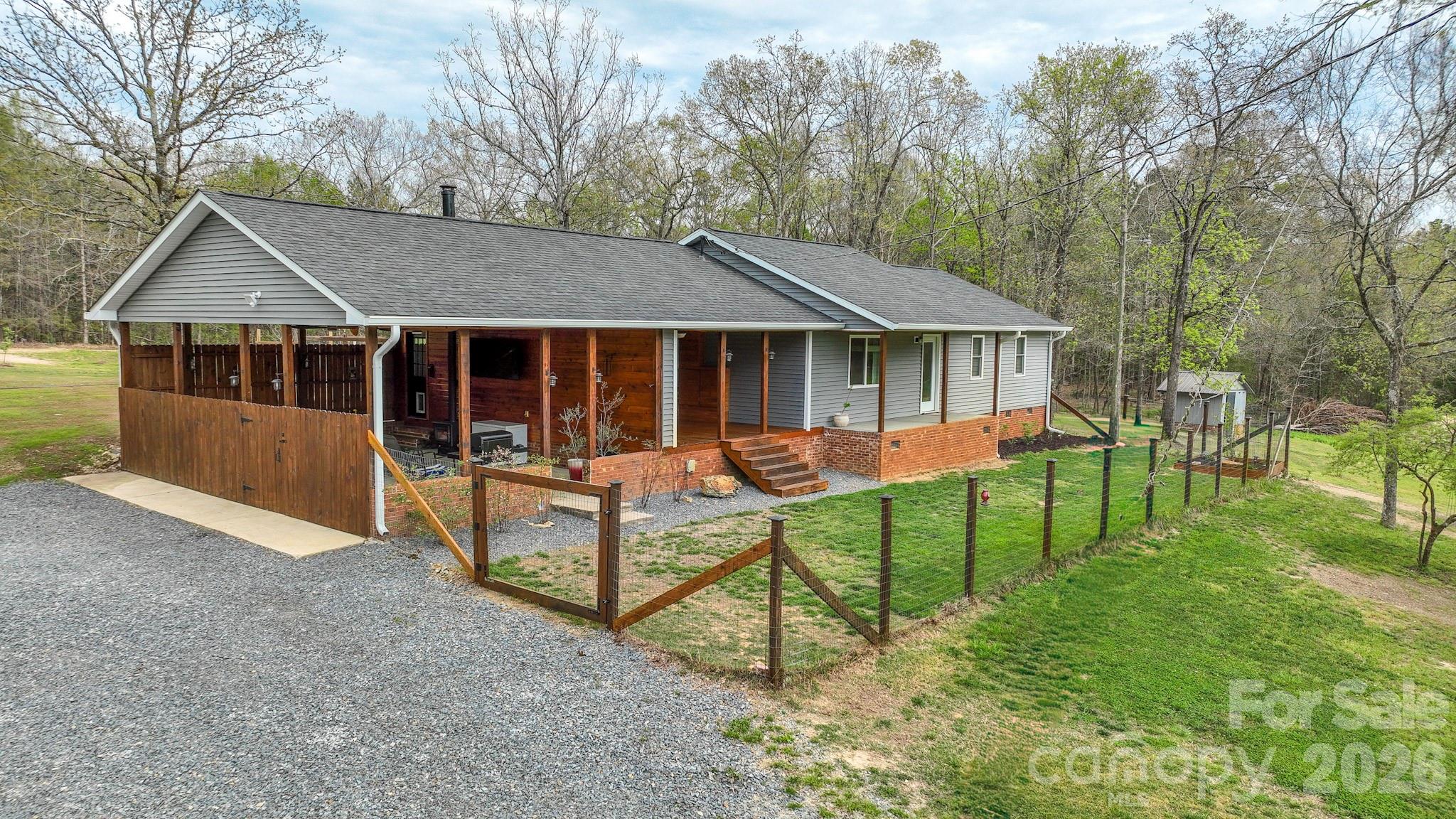 1925 Sojourn Road Marshville, NC 28103 - Photo 6 of 41 a view of house with a yard and trees