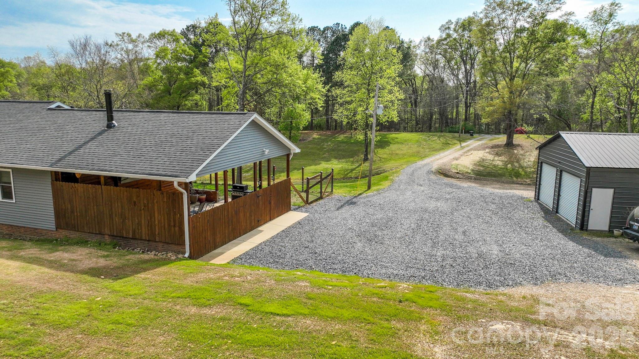 1925 Sojourn Road Marshville, NC 28103 - Photo 10 of 41 a view of a house with backyard and trees