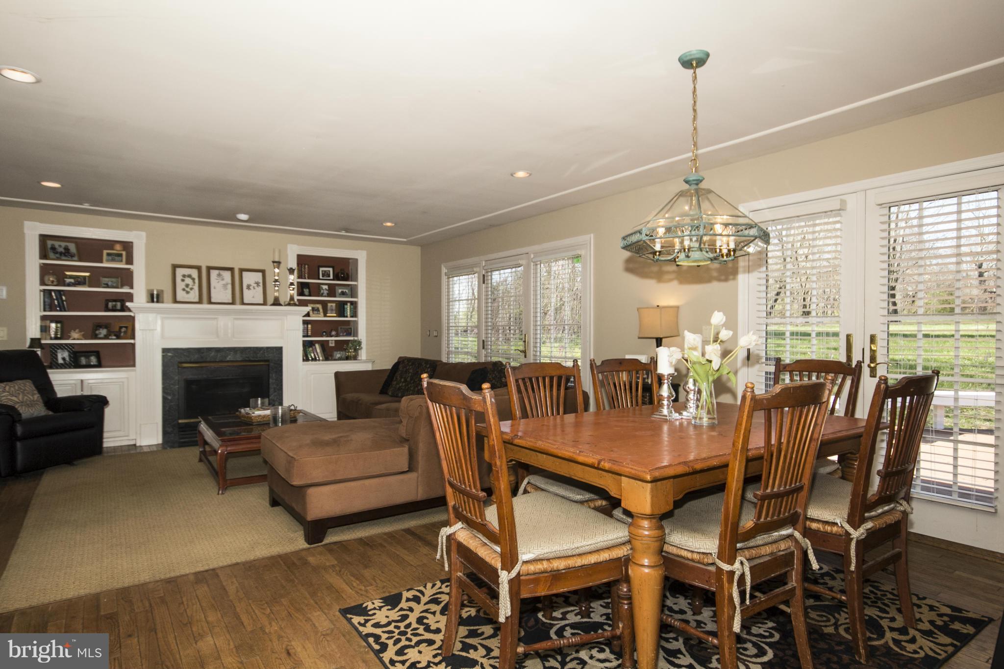 16200 Yeoho Road Sparks, MD 21152 - Photo 12 of 30 a view of a dining room with furniture a chandelier and wooden floor