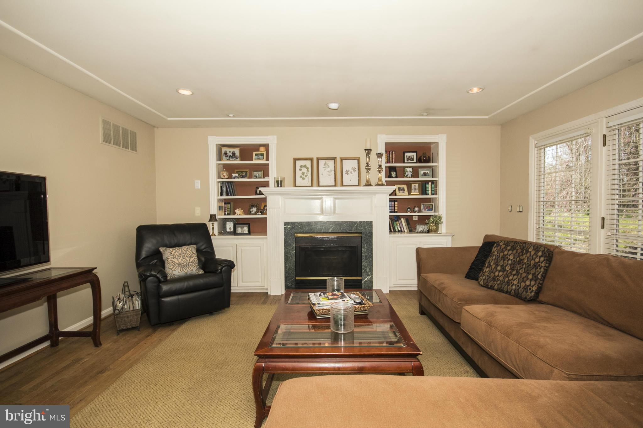 16200 Yeoho Road Sparks, MD 21152 - Photo 14 of 30 a living room with furniture and a fireplace