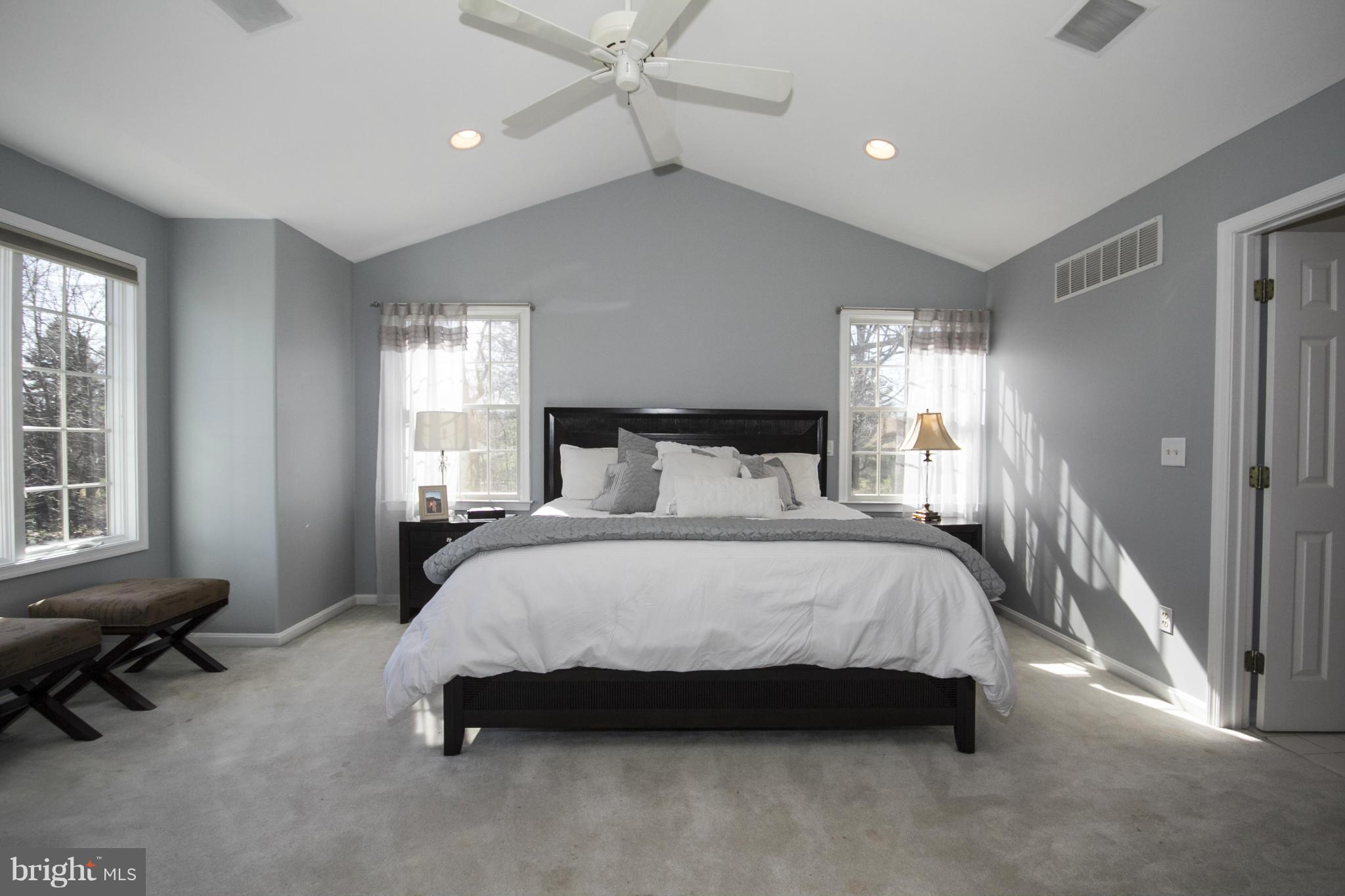 16200 Yeoho Road Sparks, MD 21152 - Photo 19 of 30 a spacious bedroom with a bed a couch and large window