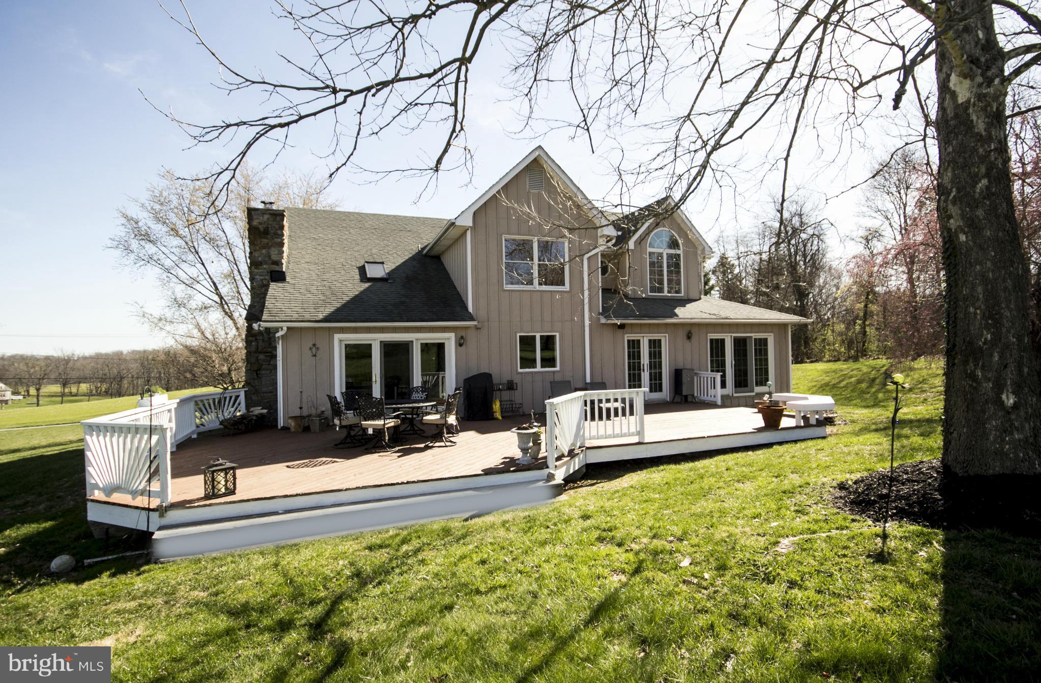 16200 Yeoho Road Sparks, MD 21152 - Photo 3 of 30 a front view of a house with swimming pool garden and outdoor seating