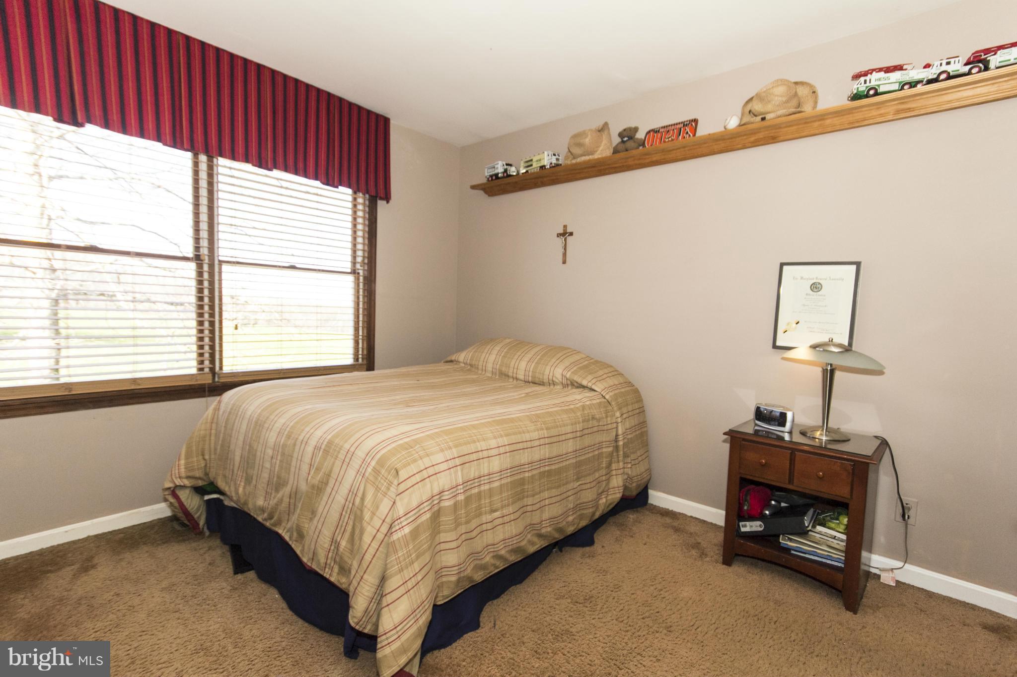16200 Yeoho Road Sparks, MD 21152 - Photo 25 of 30 a spacious bedroom with a bed and a window