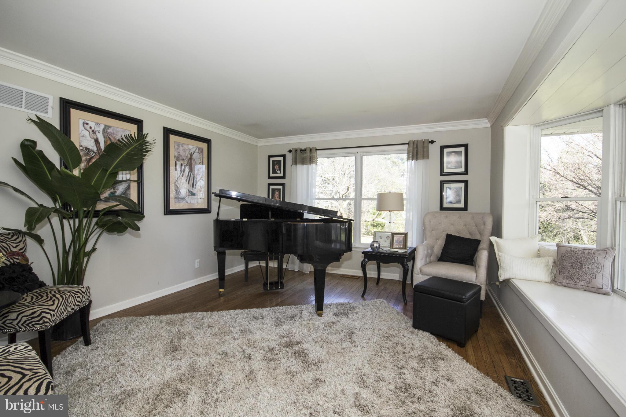16200 Yeoho Road Sparks, MD 21152 - Photo 5 of 30 a living room with furniture a table and a large window