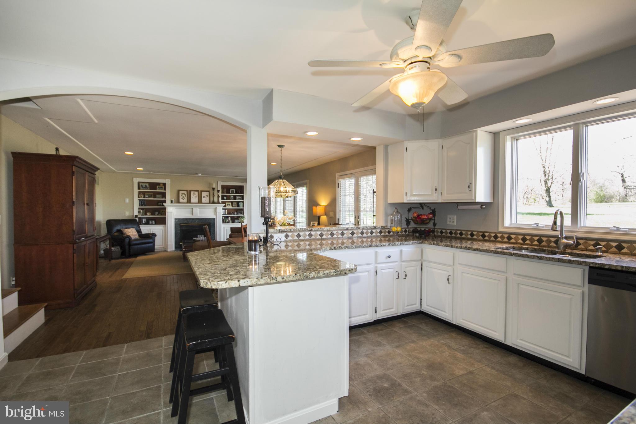16200 Yeoho Road Sparks, MD 21152 - Photo 10 of 30 a kitchen with kitchen island granite countertop lots of counter top space and sink