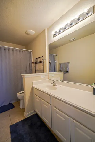 a bathroom with a sink and mirror