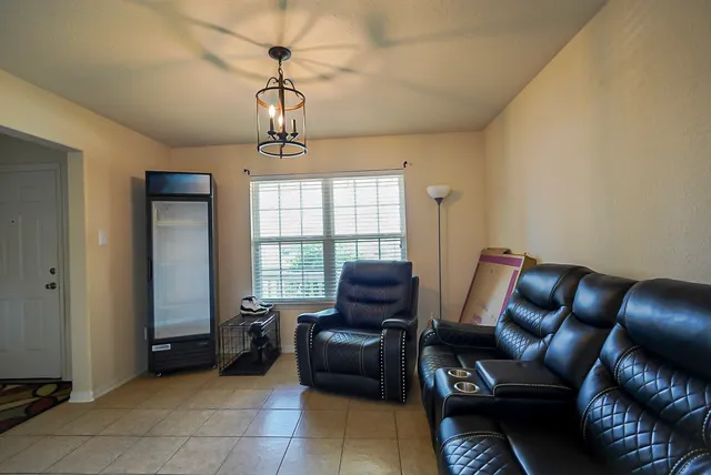 a living room with furniture and a window