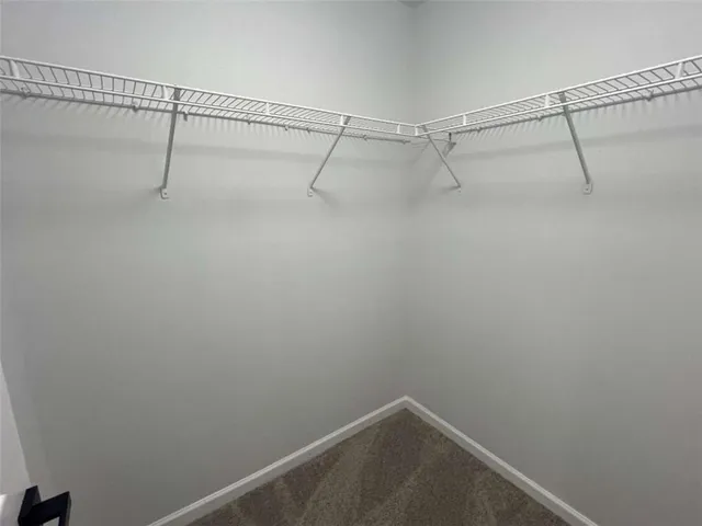 a bathroom with a granite countertop sink double and mirror