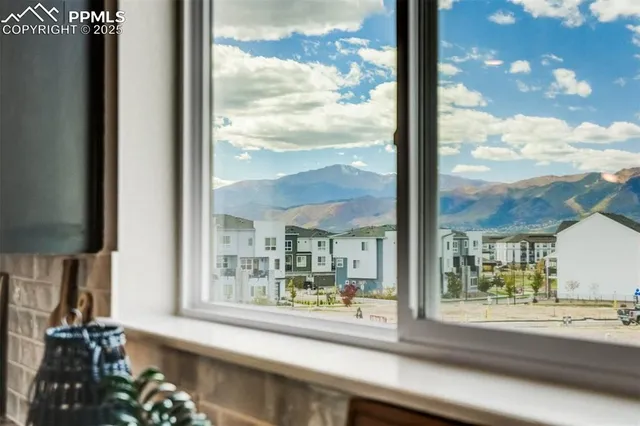 a view of a living room and a floor to ceiling window