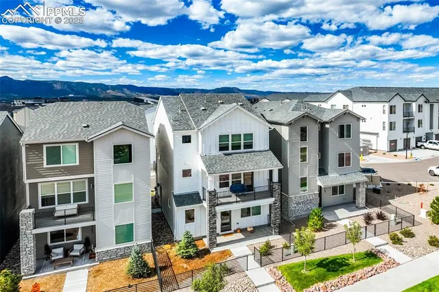 a front view of a building with a garden
